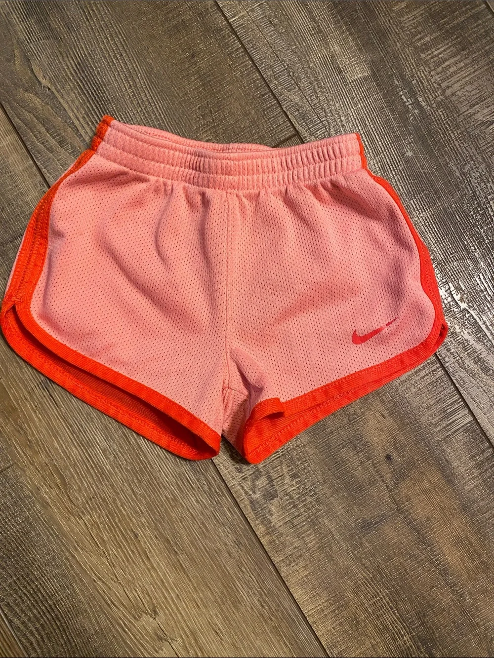 Nike Women’s Pink Athletic Mesh Shorts with Orange Trim